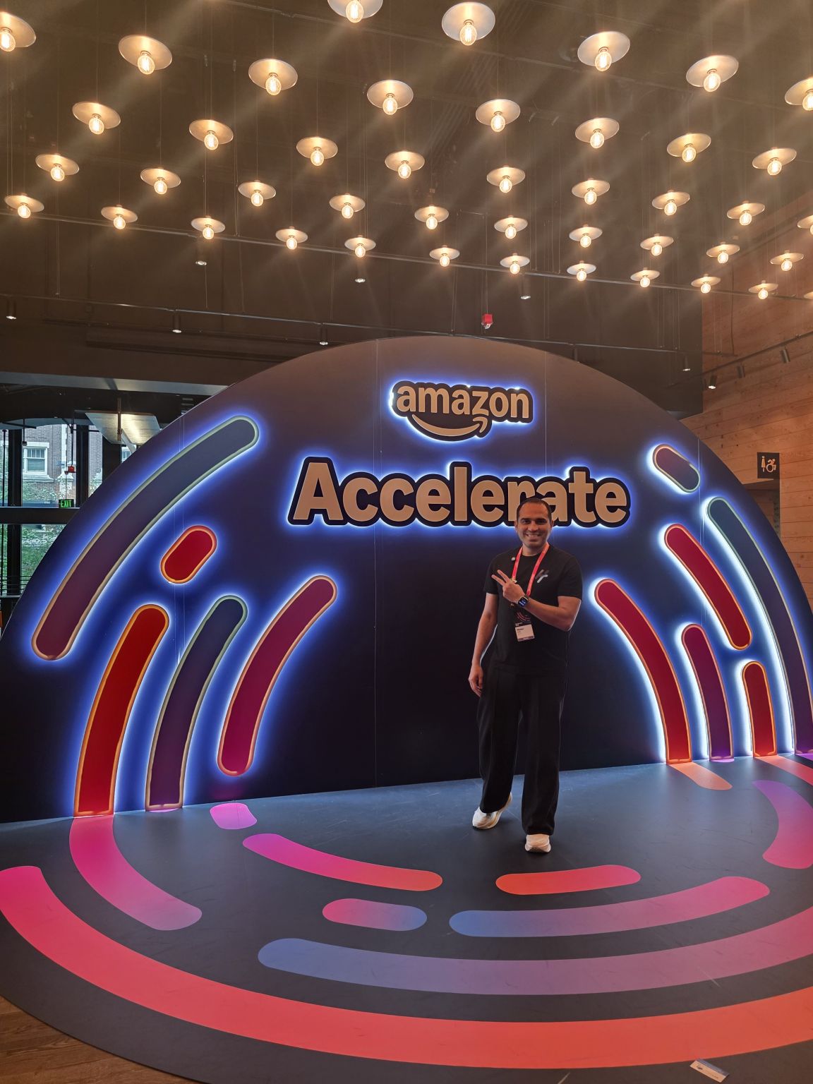 Meher Patel, Founder of Hector Ai, at the Amazon Accelerate 2026 entrance arch in Seattle